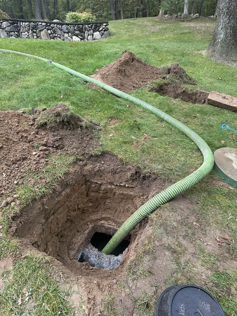 adept septic services performing routine septic pumping